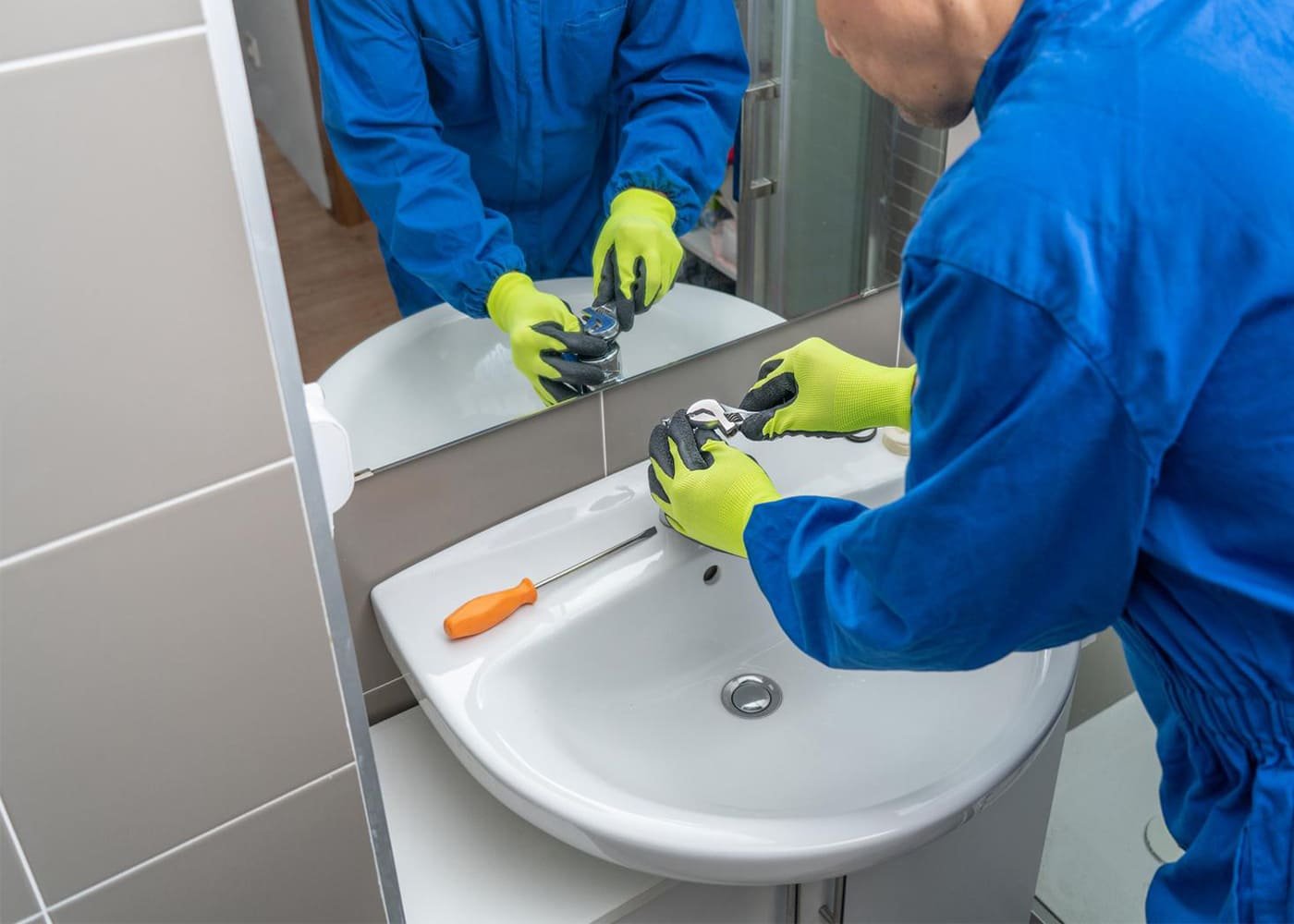 Professional plumbing installation in modern bathroom