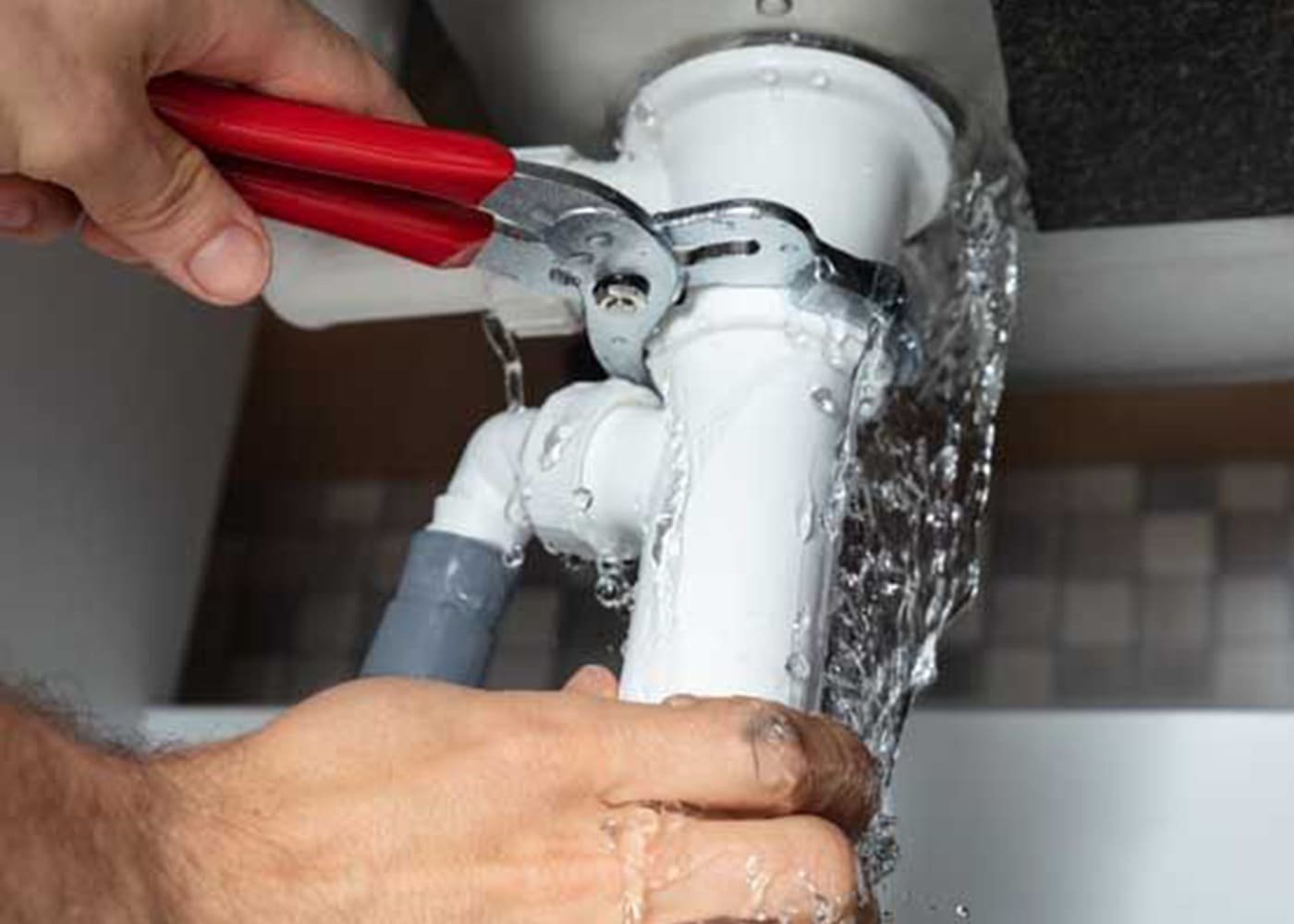 Plumber repairing pipe system